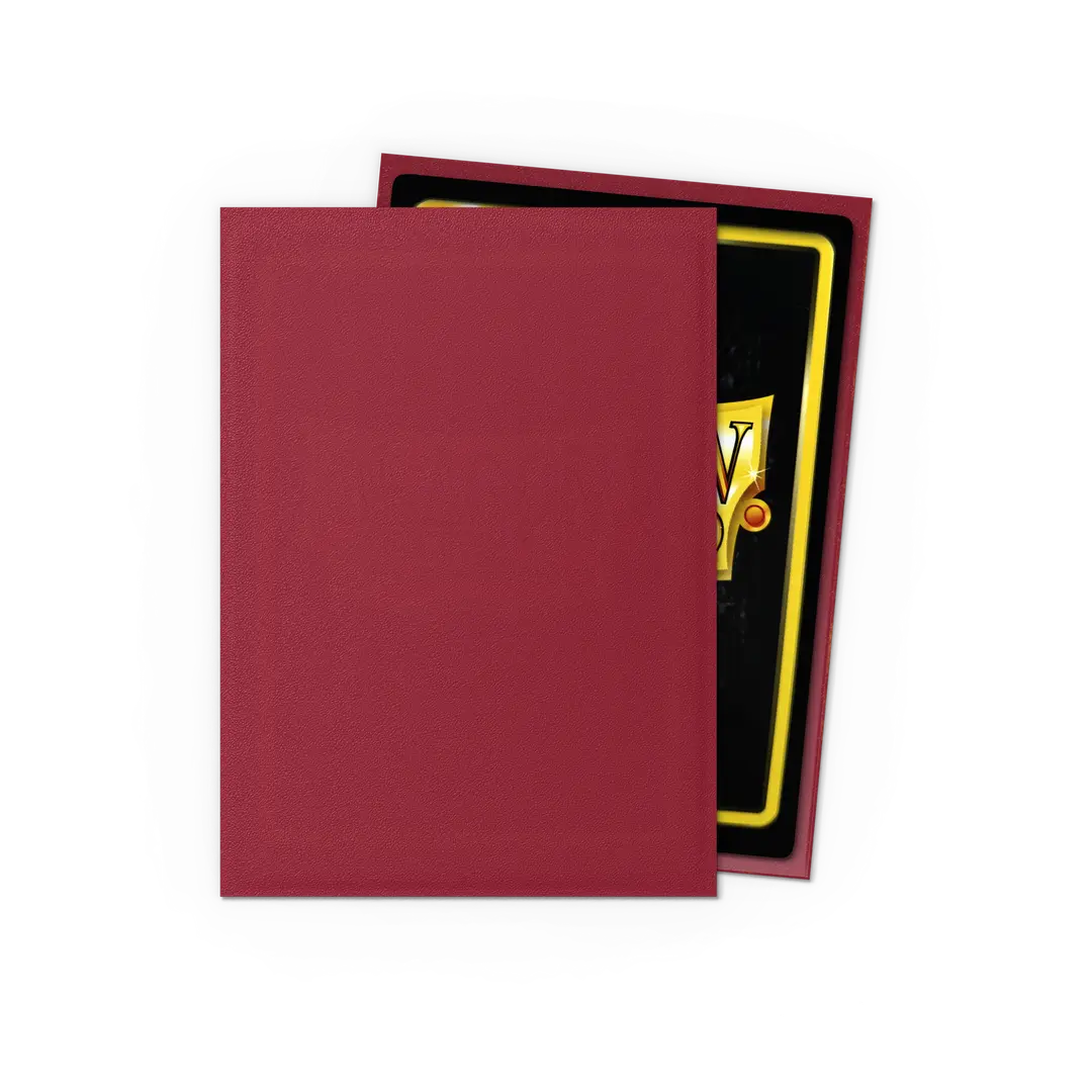 Red trading card sleeve covering a collectible card on black background