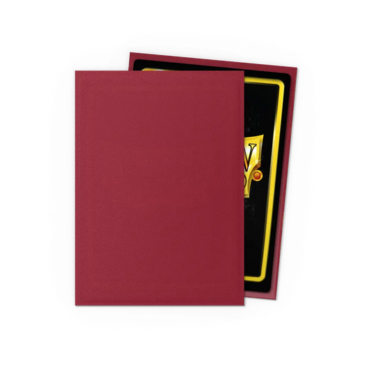 Red trading card sleeve covering a collectible card on black background