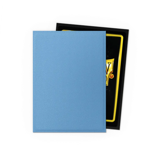 Light blue trading card sleeve covering collectible card on black background